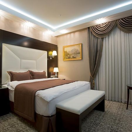 Boutique Hotel Buta Minsk Exterior photo A bedroom at the hotel