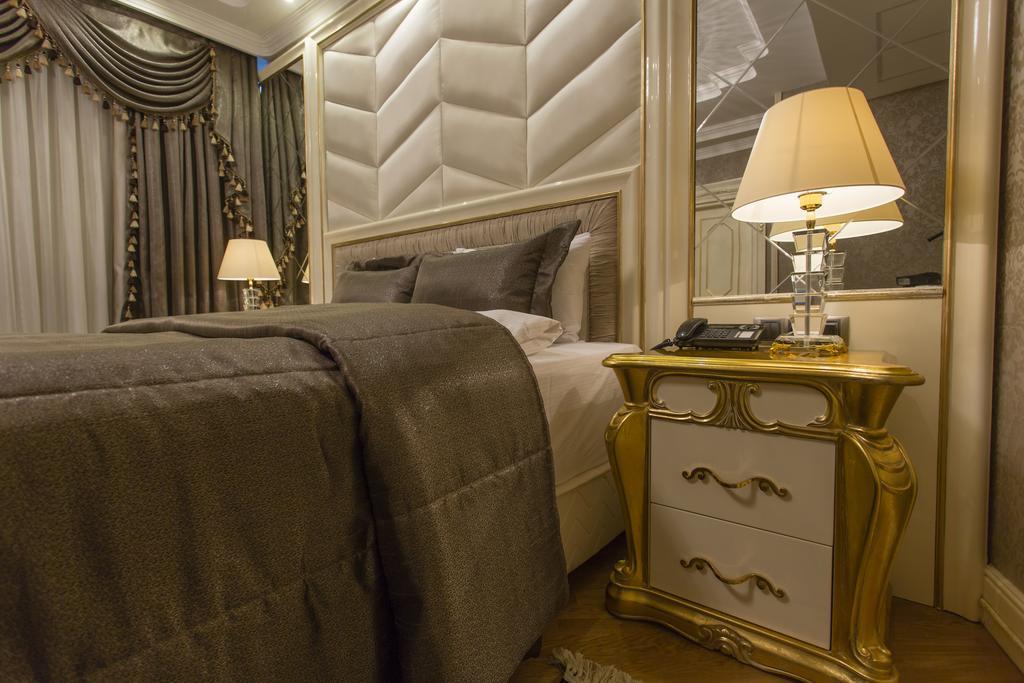 Boutique Hotel Buta Minsk Exterior photo A bedroom in the hotel