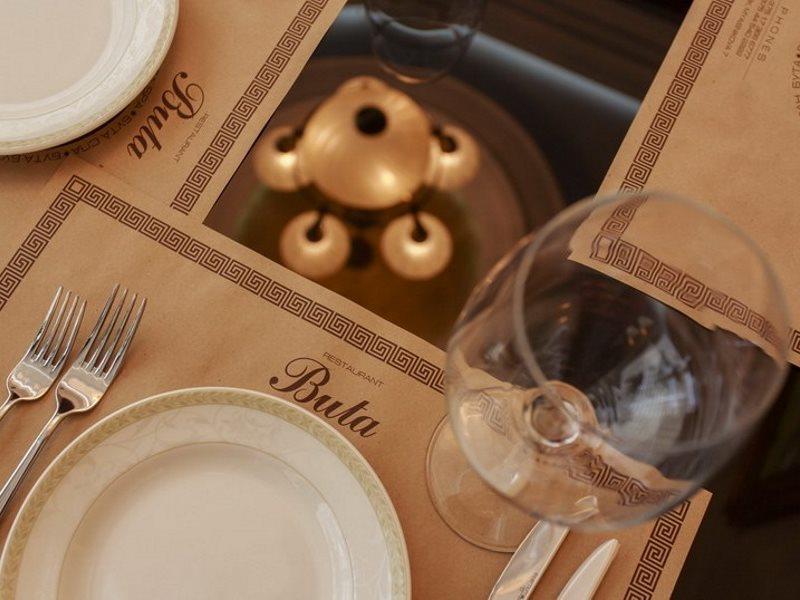 Boutique Hotel Buta Minsk Exterior photo A table at Bulà