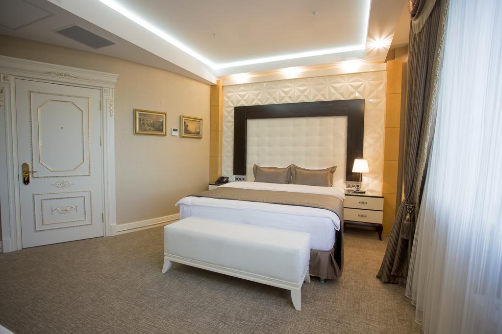 Boutique Hotel Buta Minsk Exterior photo A bedroom at the hotel