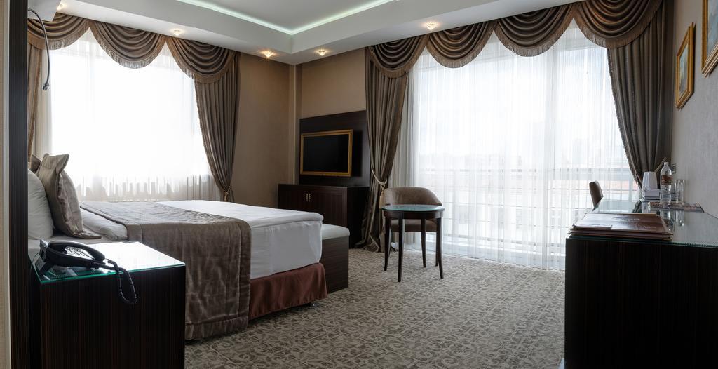 Boutique Hotel Buta Minsk Exterior photo A bedroom at the hotel