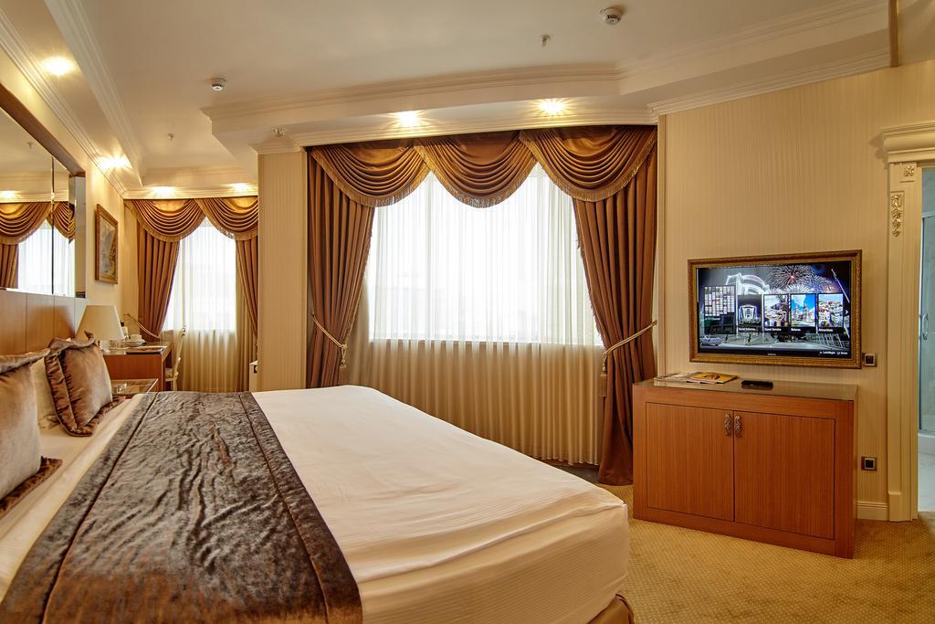 Boutique Hotel Buta Minsk Exterior photo A bedroom at the hotel
