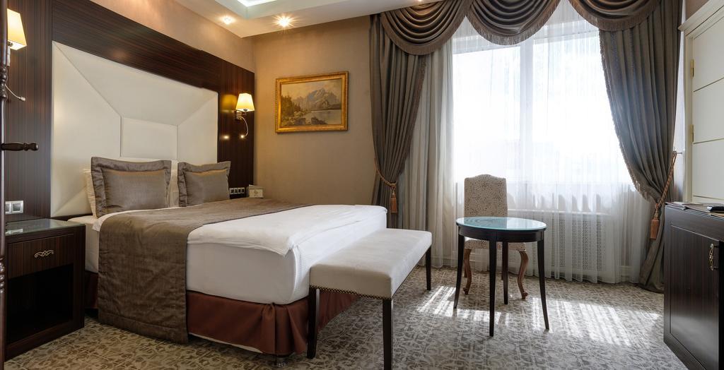 Boutique Hotel Buta Minsk Exterior photo A room at the hotel