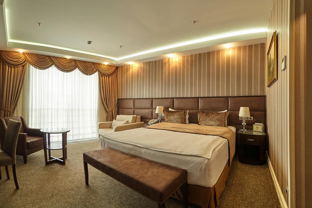 Boutique Hotel Buta Minsk Exterior photo A bedroom at the hotel