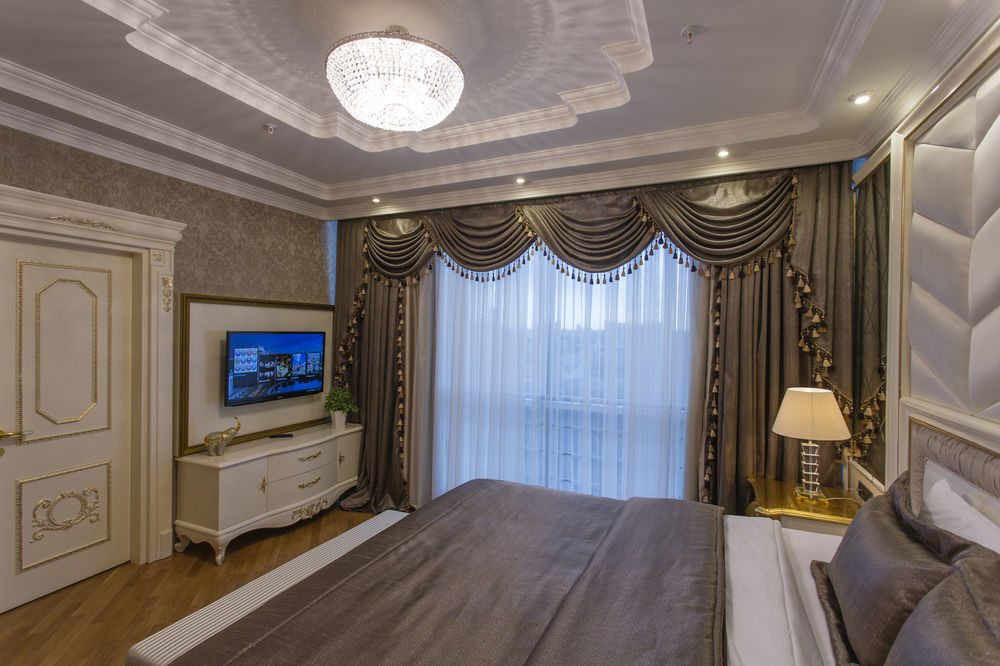 Boutique Hotel Buta Minsk Exterior photo A bedroom at the hotel