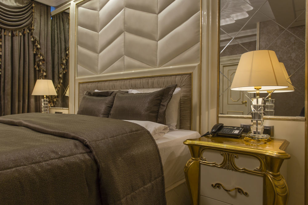Boutique Hotel Buta Minsk Exterior photo A bedroom at the hotel