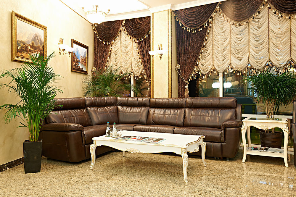 Boutique Hotel Buta Minsk Exterior photo A living room with a leather sofa