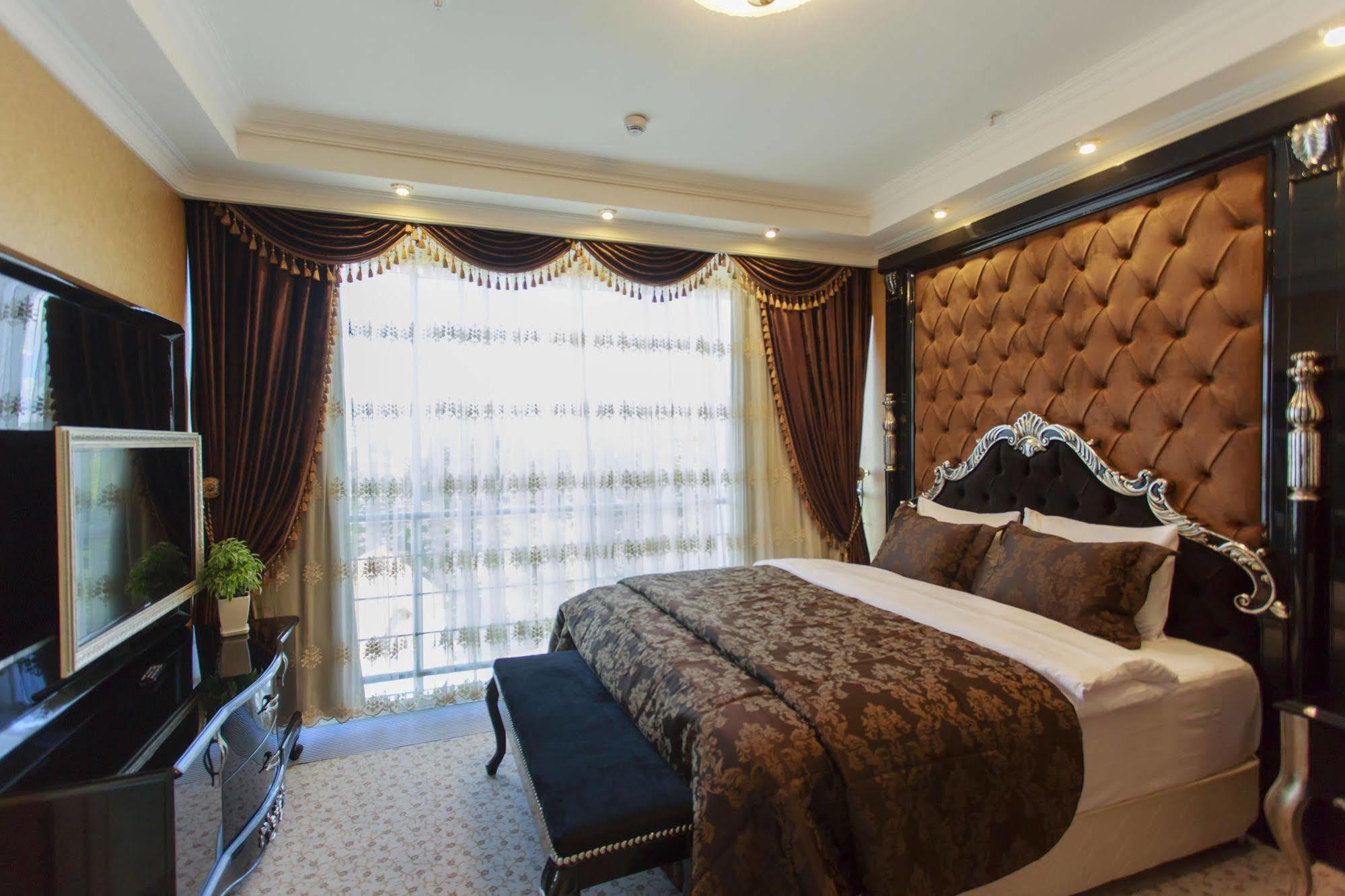 Boutique Hotel Buta Minsk Exterior photo A bedroom at the hotel