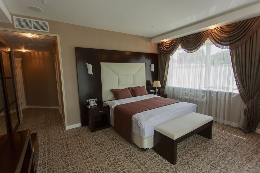 Boutique Hotel Buta Minsk Exterior photo A bedroom at the hotel