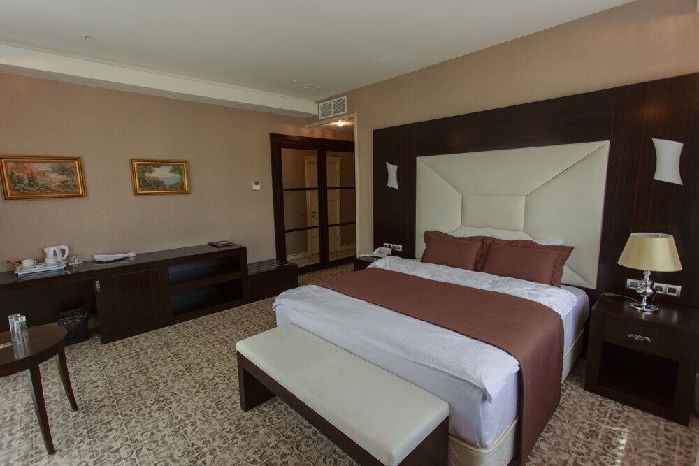 Boutique Hotel Buta Minsk Exterior photo A bedroom at the hotel